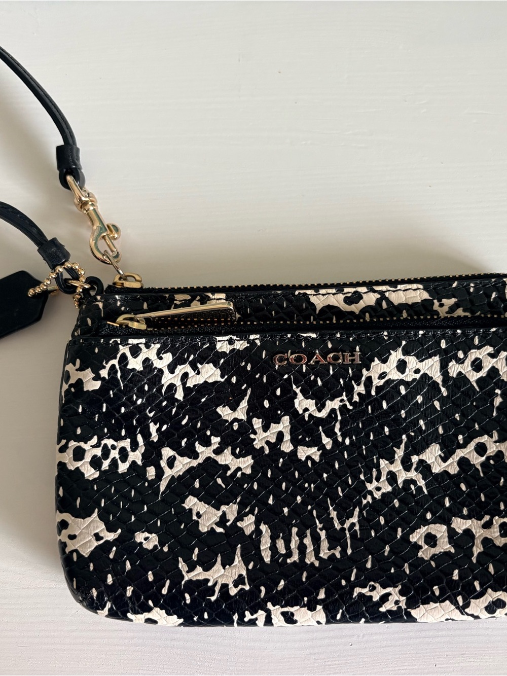 COACH Black and White Patterned Wristlet with Gold Hardware